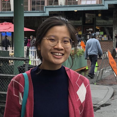 student posing in street